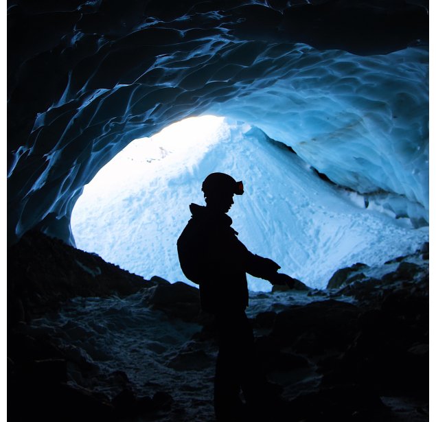 lonely-male-hiking-mountains-cage-covered-with-snow-daytime